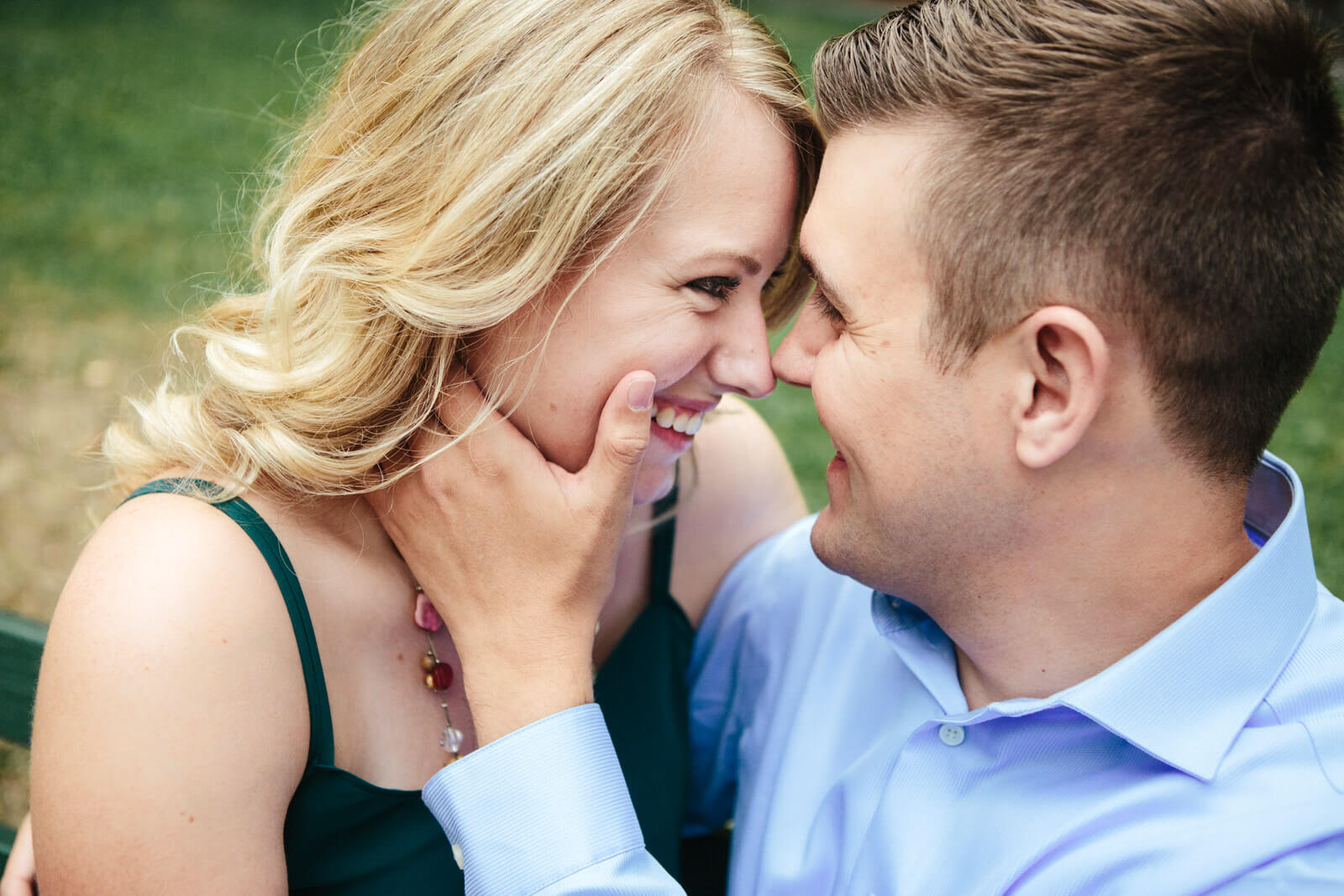 A couple smiles at one another during their engagement session in Missoula Montana