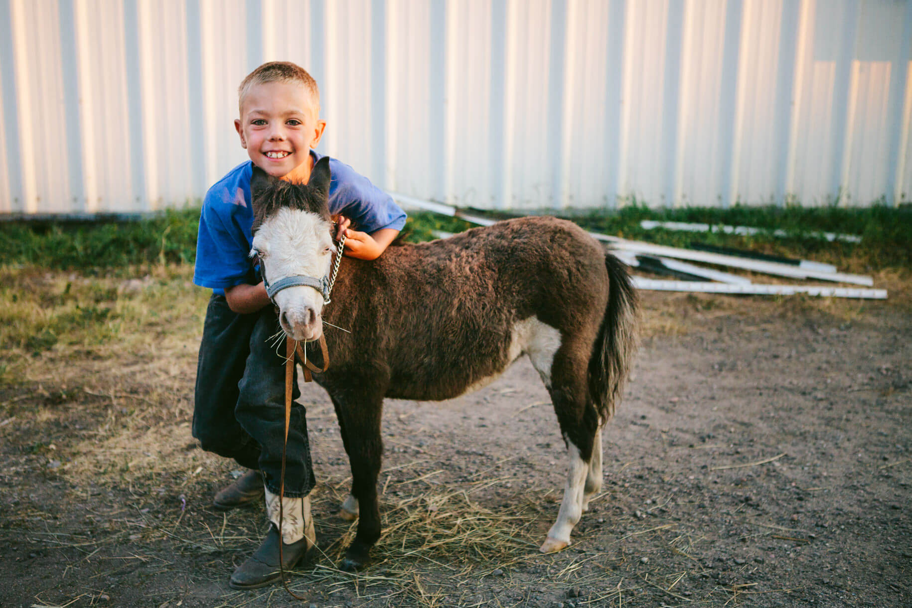A boy hugs his pony at the Western Montana State Fair in Missoula Montana