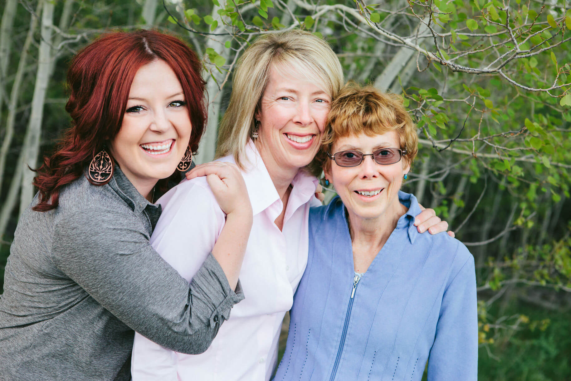 A daughter, mother, and grandmother embrace during their family portraits in Missoula Montana
