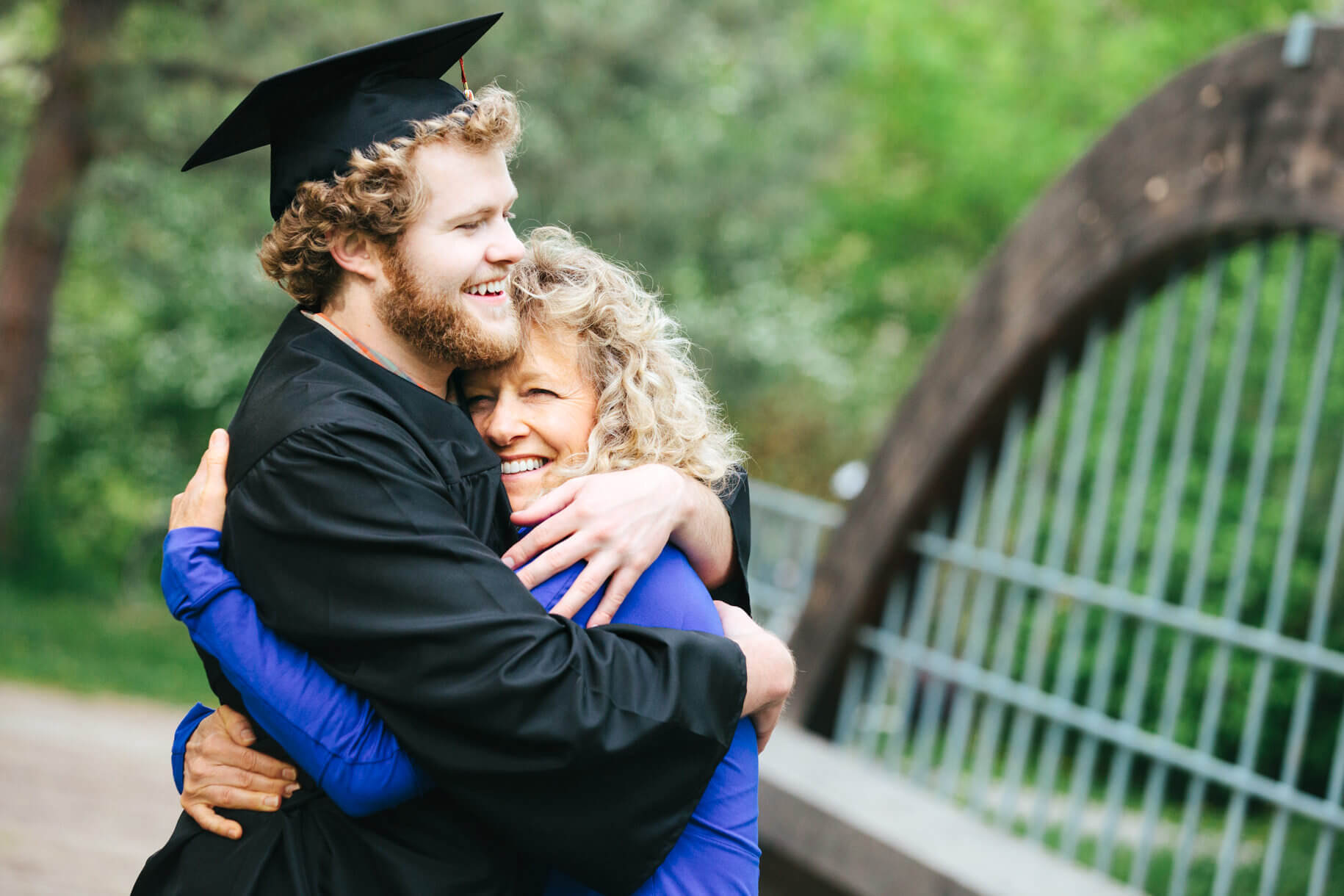 A mother and son hug during their graduation portrait photos in Missoula Montana