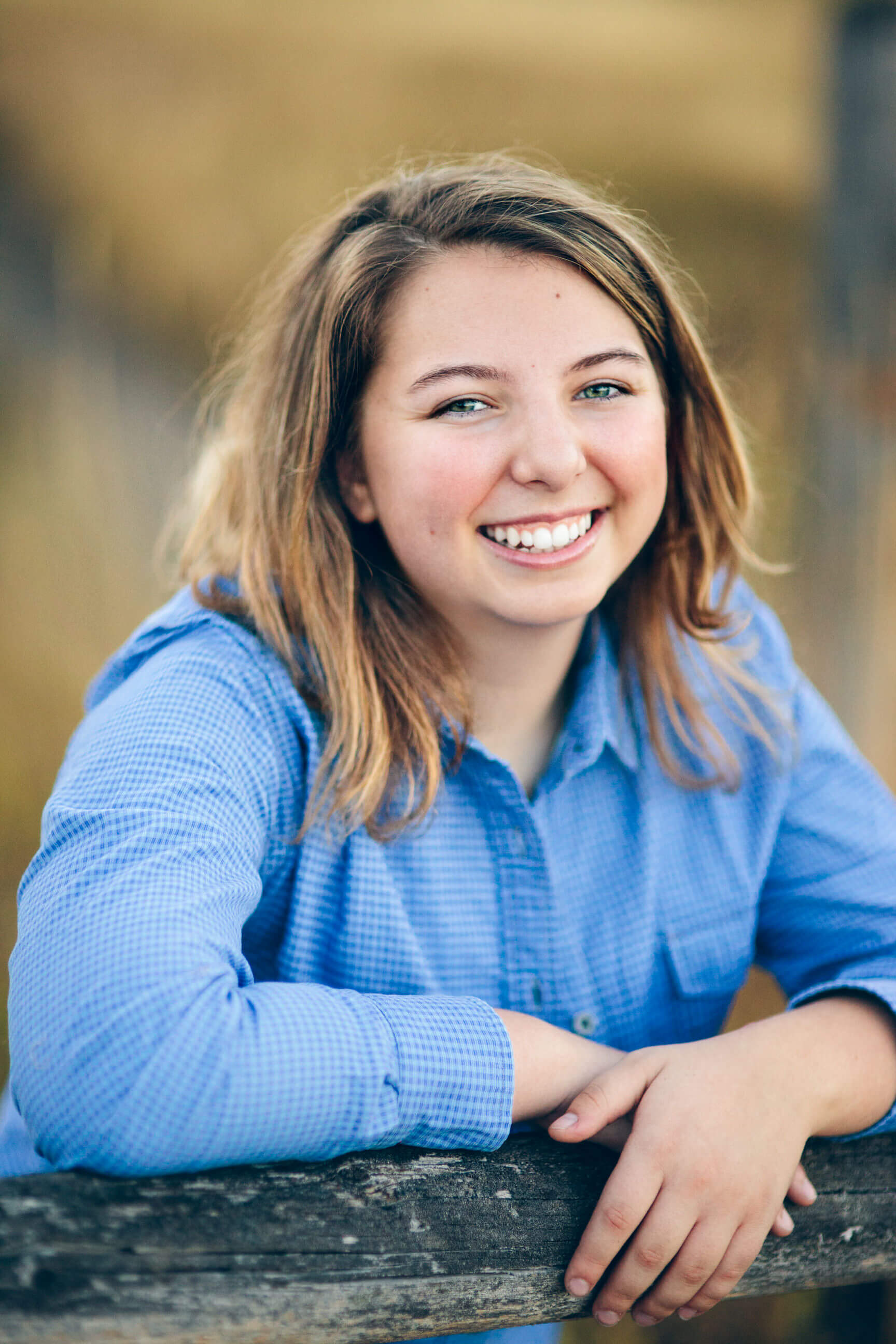 A senior girl smiles at her senior session in Missoula Montana